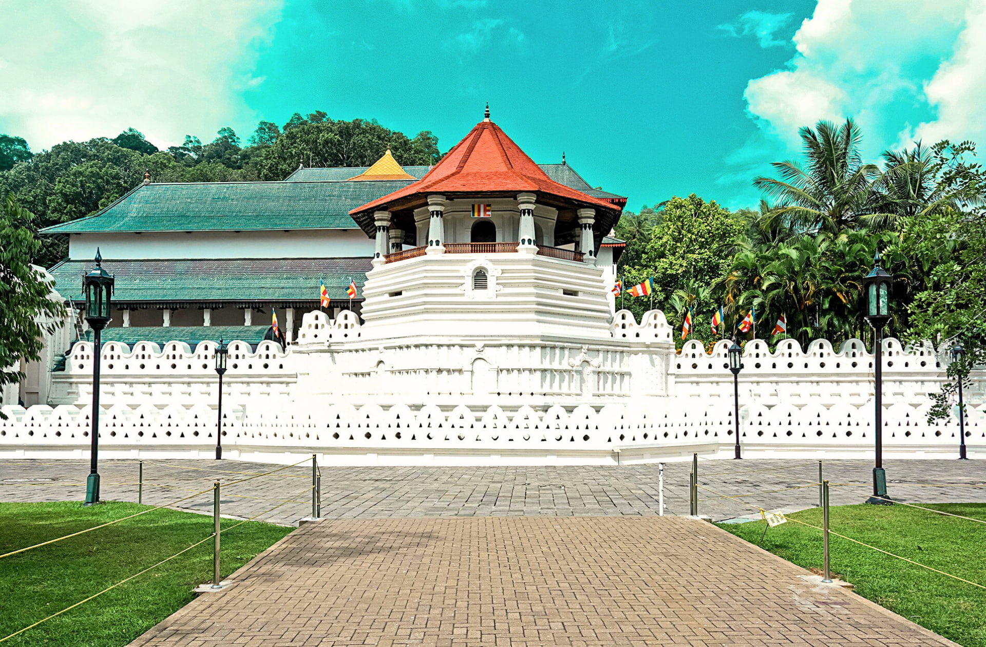 The iconic white cloud wall and octagonal pavilion of the Temple of the Sacred Tooth Relic in Kandy, Sri Lanka.
